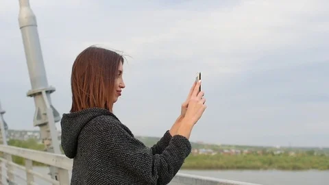 Woman using smartphone in the European city. Slow Motion, 4K. Hipster girl Stock Footage