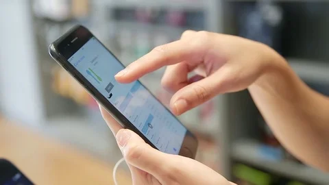 Woman using smartphone Stock Footage 77045405