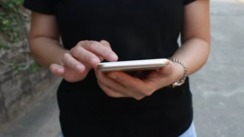 Woman using smartphone Видео 103998037