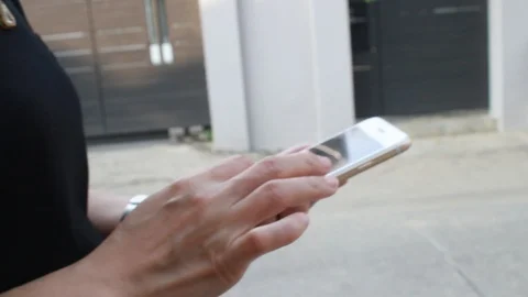 Woman using smartphone Видео 103998094