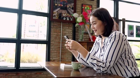 Woman using a smartphone. 스톡 동영상 115123456