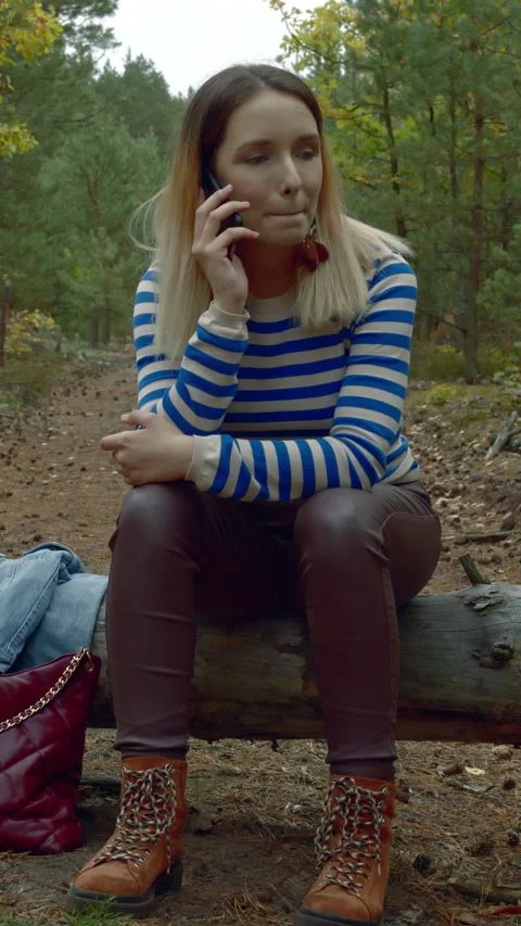 Woman using smartphone in the forest. Stock Footage 280768878