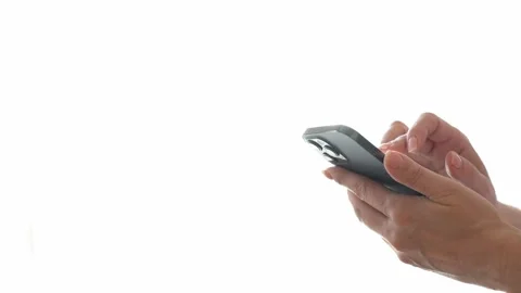 Woman using a smartphone in front of a window brightly lit by daylight Stock Footage 280534884