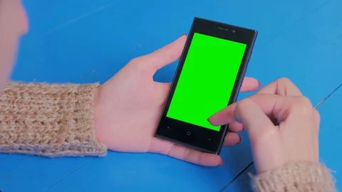 Woman using smartphone with green screen Stock Footage