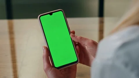 Woman using smartphone with green screen chroma key Stock-Footage 334137044