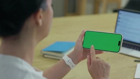 Woman Using Smartphone with Green Screen Chroma Key at Her Desk in Office. W Stock Footage 341865814