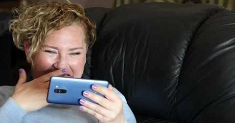 Woman using smartphone at home Stock Footage 150251462