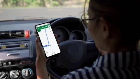 Woman using a smartphone inside the car. Chromakey smartphone with green screen. Stock Footage 170690751