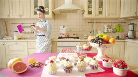 Woman using smartphone in the kitchen Video stock 62745771