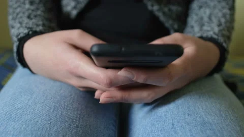 Woman using smartphone for messaging chat on a smartphone,hi tech addiction Stock Footage 147560893