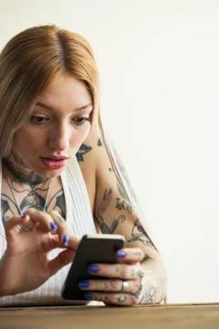 Woman using smartphone Stock Photos