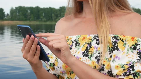 Woman using smartphone sensor Stock Footage 243187348