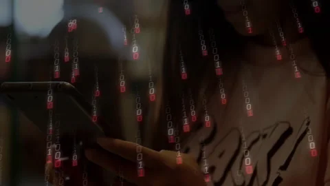 Woman using smartphone tapping screen and causing binary rain showing technology Stock Footage 312099858