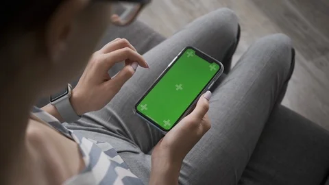Woman using smartphone with touching screen for internet surfing on-line. Stock Footage 104517264
