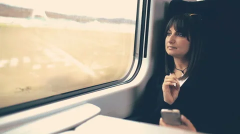 Woman using smartphone in train. Handheld shot Stock Footage 43421419