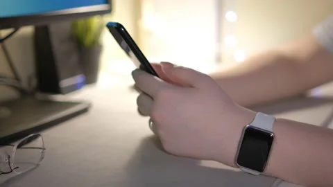 Woman using smartphone in vertical mode . Close-up hands of unrecognizable Stock-Footage 235341383