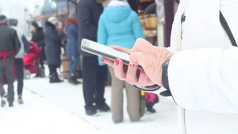 Woman is using smartphone winter Stock Footage 81790286