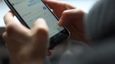 Woman using smartphone writes message text on social network. Phone screen  Stock Footage 118613514