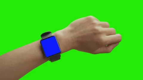 Woman using smartwatch with chroma key close-up. Young female person wearing fit Stock Footage 198296970