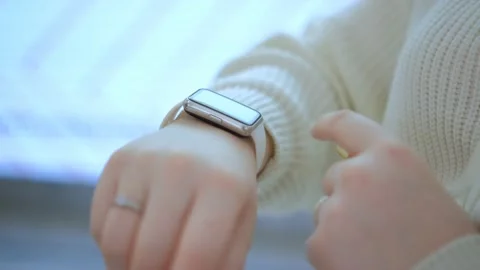 Woman using smartwatch touchscreen wearable technology device. Closeup. Smart Stock Footage 232598326