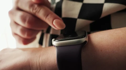 Woman using a smartwatch touchscreen. Wearing equipment during working day Stock-Footage 314557097