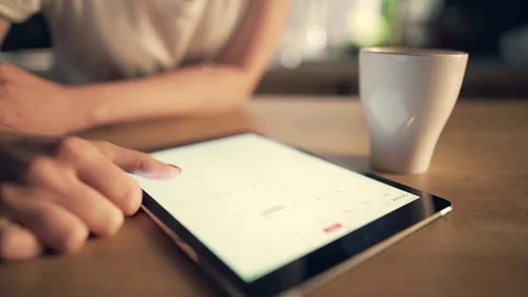 Woman using tablet and drinking coffee Stock Footage 74524482