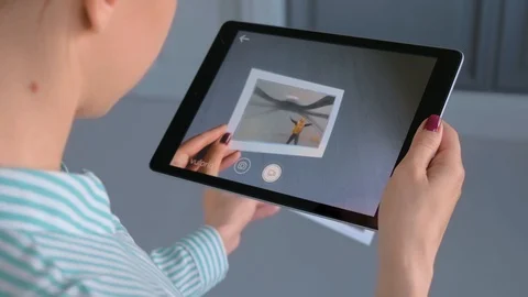 Woman using tablet with AR application: contemporary art, surrealism concept Stock Footage 128925618