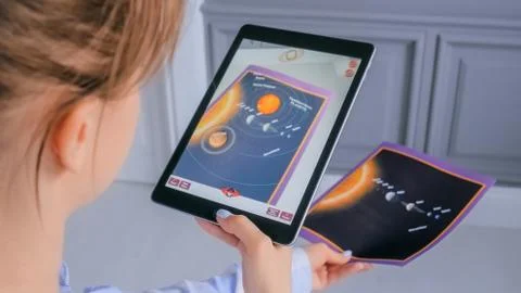 Woman using tablet with augmented reality app - 3d planets of solar system Stock Photos