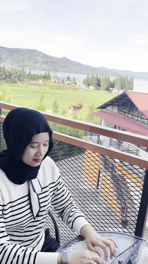 Woman Using Tablet on Balcony Stock Footage 317880210