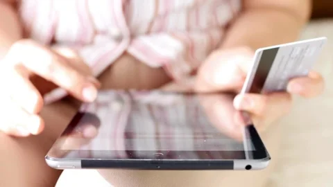 Woman using tablet for banking talking or people speaking of banking payment  Stock Footage 265928492