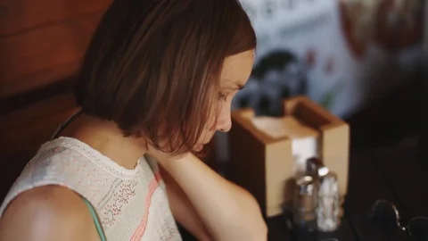 Woman using tablet in cafe Video stock 77560673