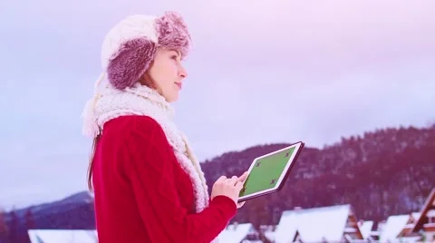 Woman Using Tablet Chromakey Screen in Winter Outdoors. STABILIZED SLOW-MO Vidéo 68828173