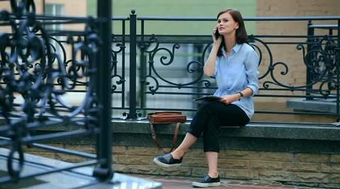 Woman using tablet computer and mobile phone to communicate with others. Stock Footage 68906175