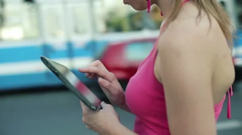 Woman using tablet computer in the city, steadicam shot HD Stock Footage 12133520