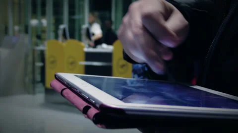 Woman using tablet computer at departure lounge Vidéo 33738313