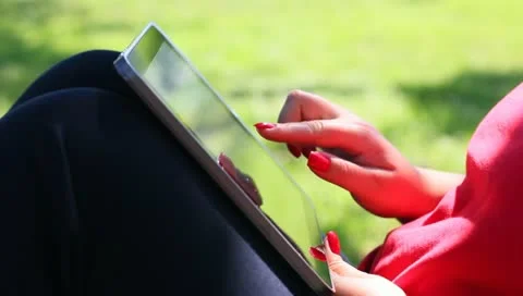 Woman using a tablet computer Stock Footage 11242023