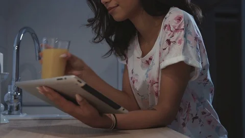 Woman using tablet computer at home. Stock Footage 70149768