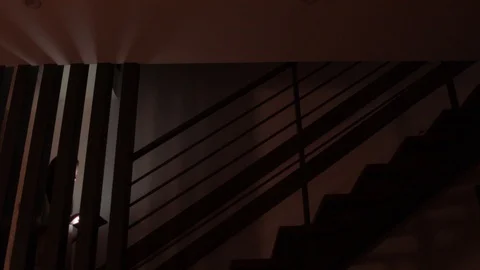 Woman using tablet computer at home at night Stock Footage 129948958