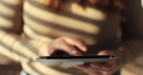 Woman using tablet computer at home. Checking social media, browsing internet Stock Footage 254154847