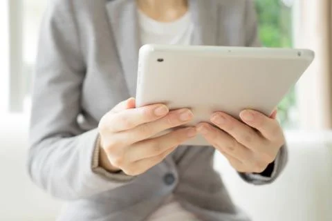 Woman using a tablet computer Foto stock