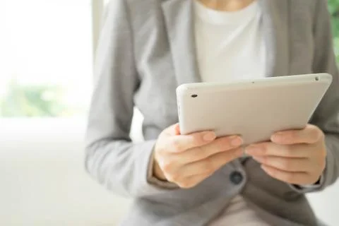 Woman using a tablet computer Foto stock