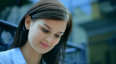 Woman using a tablet computer with a touch screen writes a message to a friend. Stock Footage 68905866