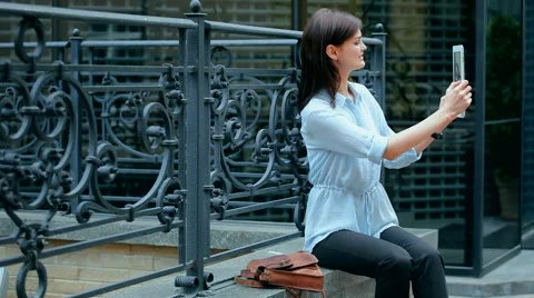 Woman using a tablet computer with a touch screen writes a message to a friend. Stock Footage 68906832