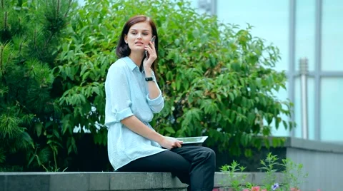 Woman using a tablet computer with a touch screen writes a message to a friend. Stock Footage 68907563