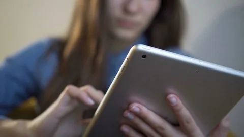 Woman using tablet computer touchscreen in cafe. Close-up Stock Footage