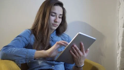 Woman using tablet computer touchscreen in cafe Stock Footage 71493101