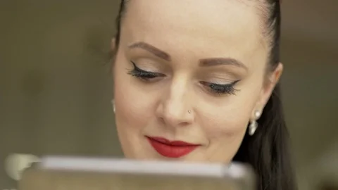 Woman using tablet computer touchscreen in cafe 1920x1080 動画素材 73417907
