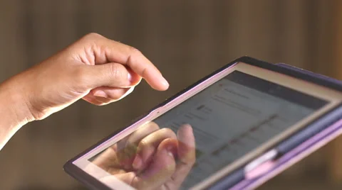 Woman using a tablet Stock Footage 35675940