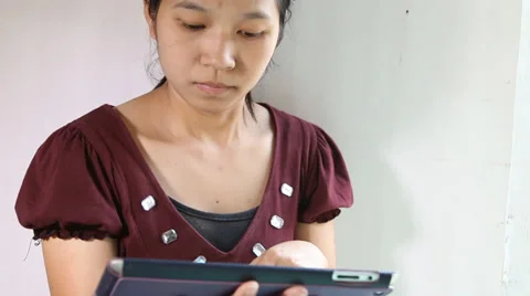 Woman using a tablet Stock Footage 35753259