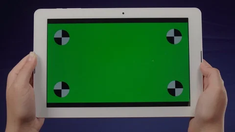 Woman using a tablet with green screen – Chroma Key 動画素材 129177152